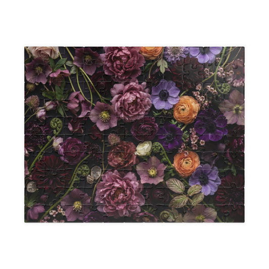 Overhead floral artwork with layered plum, mauve, dusty rose, ivory and apricot blossoms among delicate green leaves.
